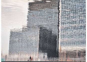 Die Wirtschaftszentralen im heutigen London spiegeln sich im Wasser der Hafenbecken des Industriezeitalters. Foto: Jörn Wegner